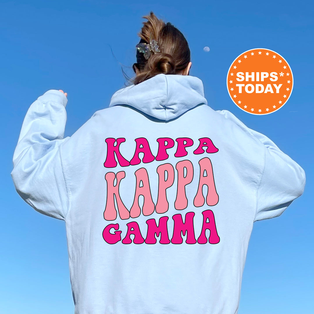 a woman wearing a white hoodie with the words kappa kappa