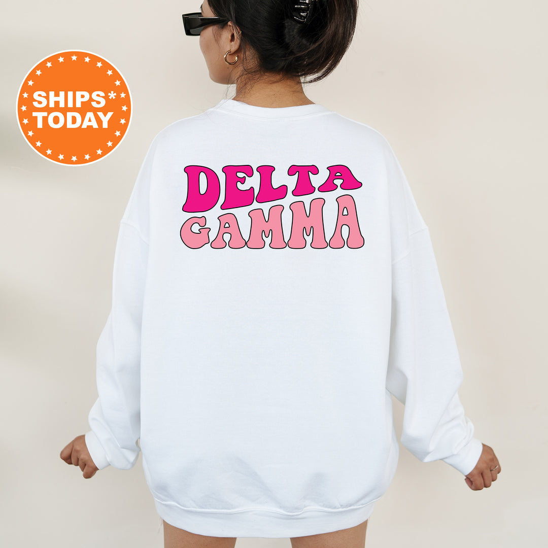 a woman wearing a white sweatshirt with the words delta gama printed on it