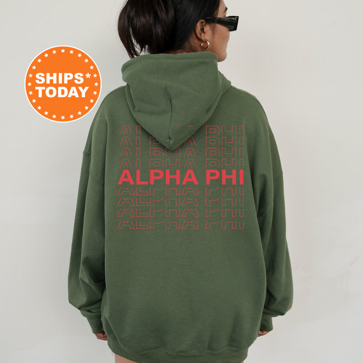 a woman wearing a green hoodie with red letters on it