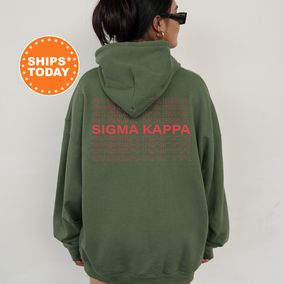 a woman wearing a green sweatshirt with the words stigma kappa printed on it