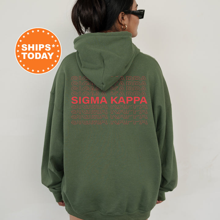 a woman wearing a green sweatshirt with the words stigma kappa printed on it
