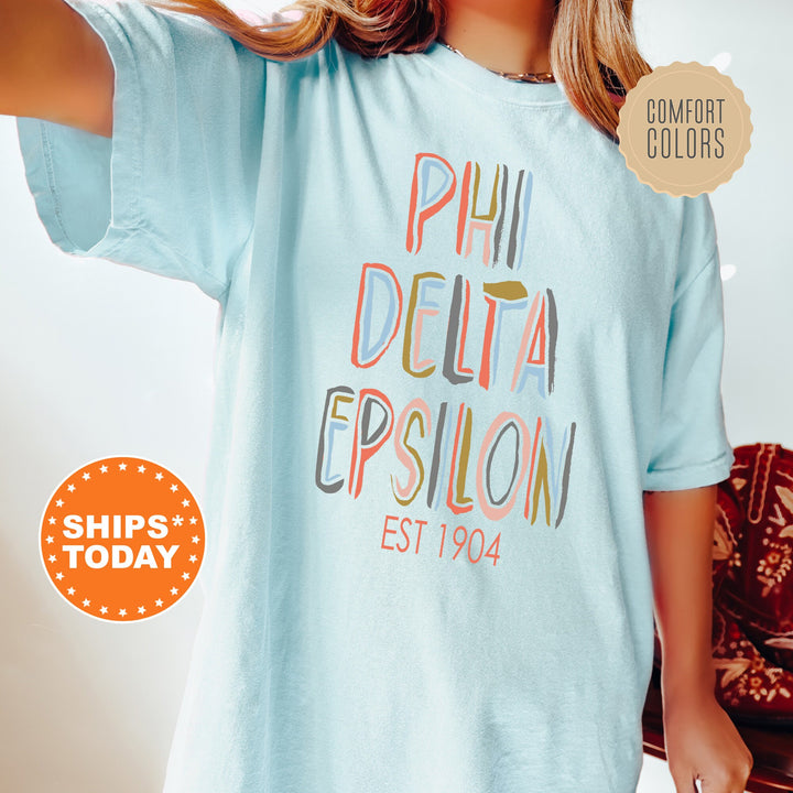 Phi Delta Epsilon Pastel Stencil Coed T-Shirt | PhiDE Fraternity Shirt | Greek Apparel | Medical Fraternity | Comfort Colors Shirt _ 8841g