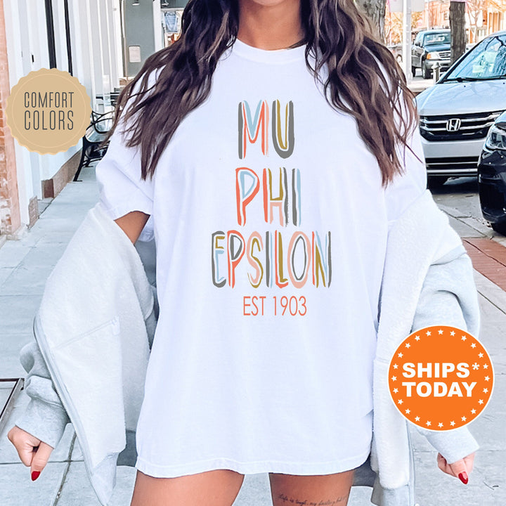 Mu Phi Epsilon Pastel Stencil Coed T-Shirt | Mu Phi Epsilon Comfort Colors Shirt | Fraternity Bid Day Gift | Custom Greek Apparel  _ 8838g