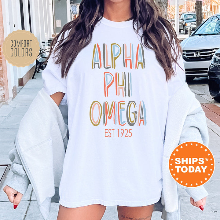 Alpha Phi Omega Pastel Stencil Coed T-Shirt | APHIO Comfort Colors Shirt | Fraternity Apparel | Bid Day Gift | Custom Greek Apparel _ 8832g