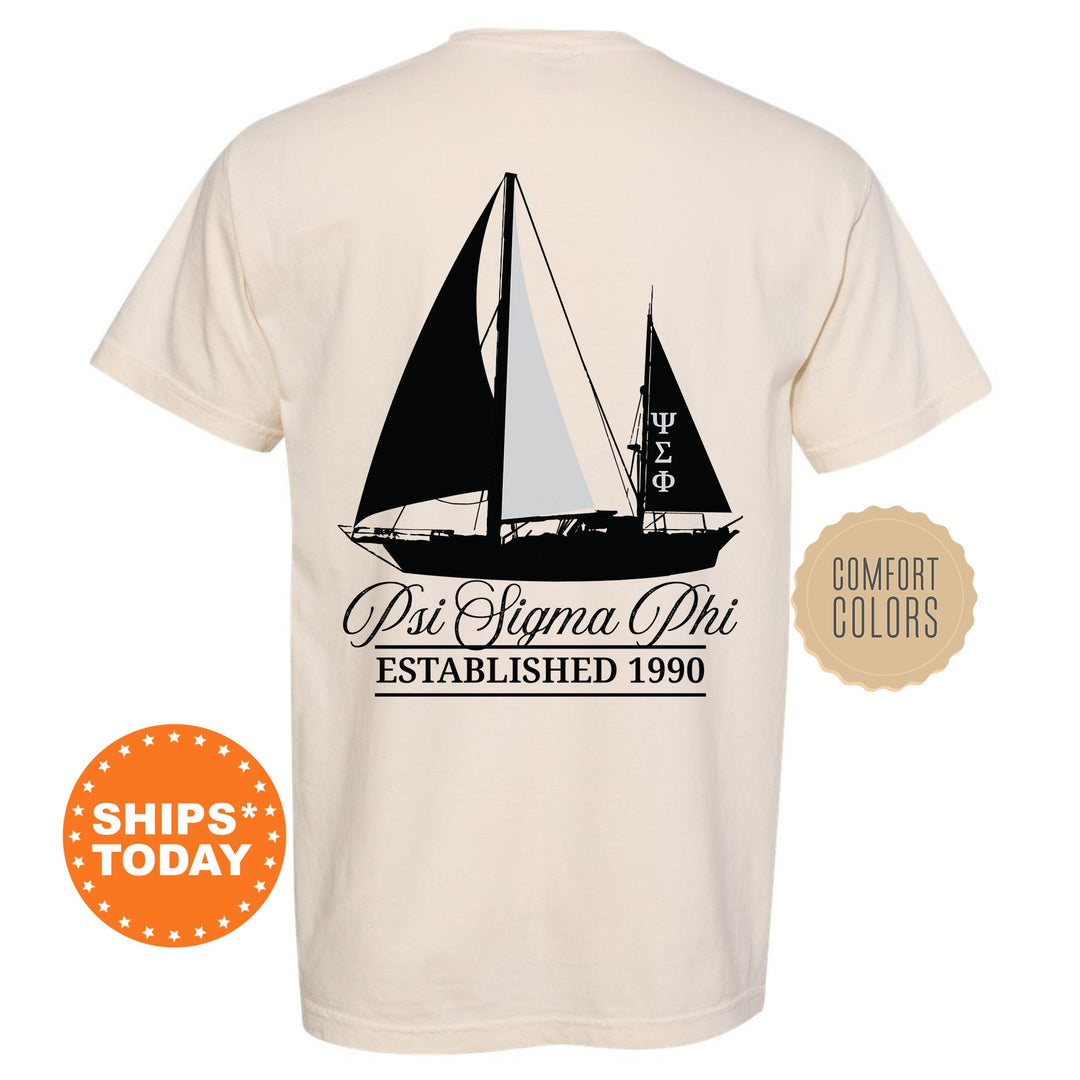 a white shirt with a black sailboat on it