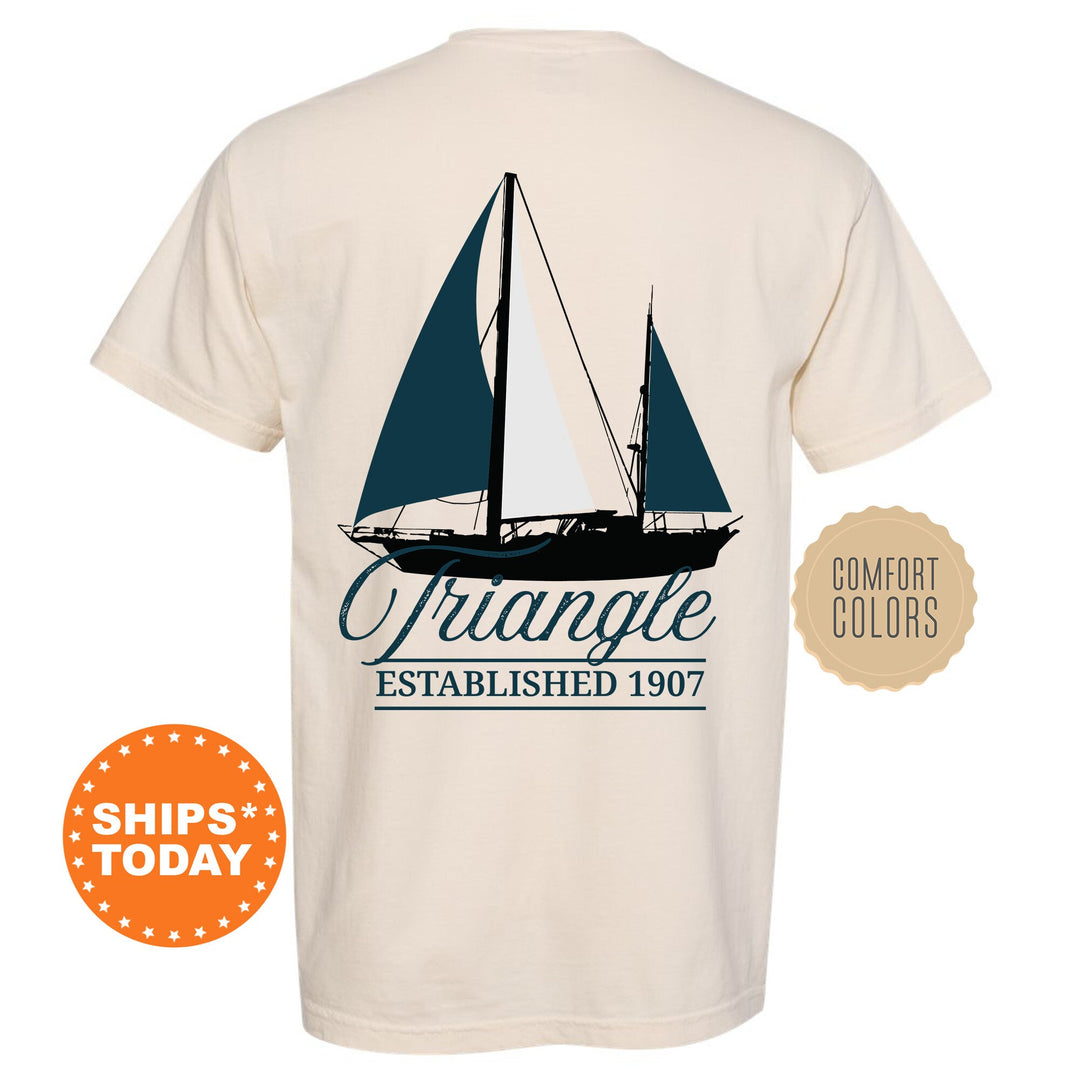a white shirt with a sailboat on it