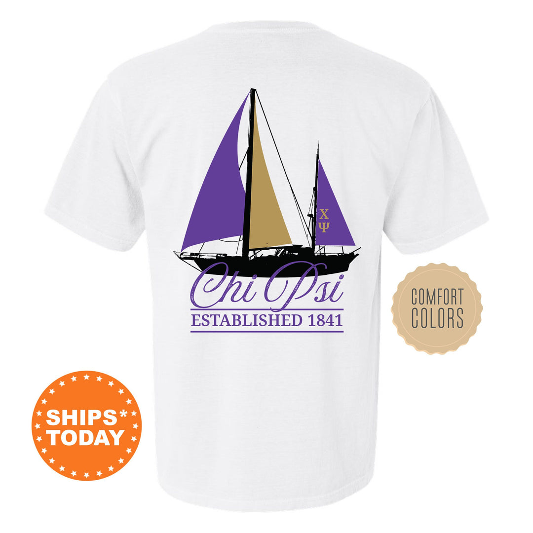 a white t - shirt with a purple sailboat on it
