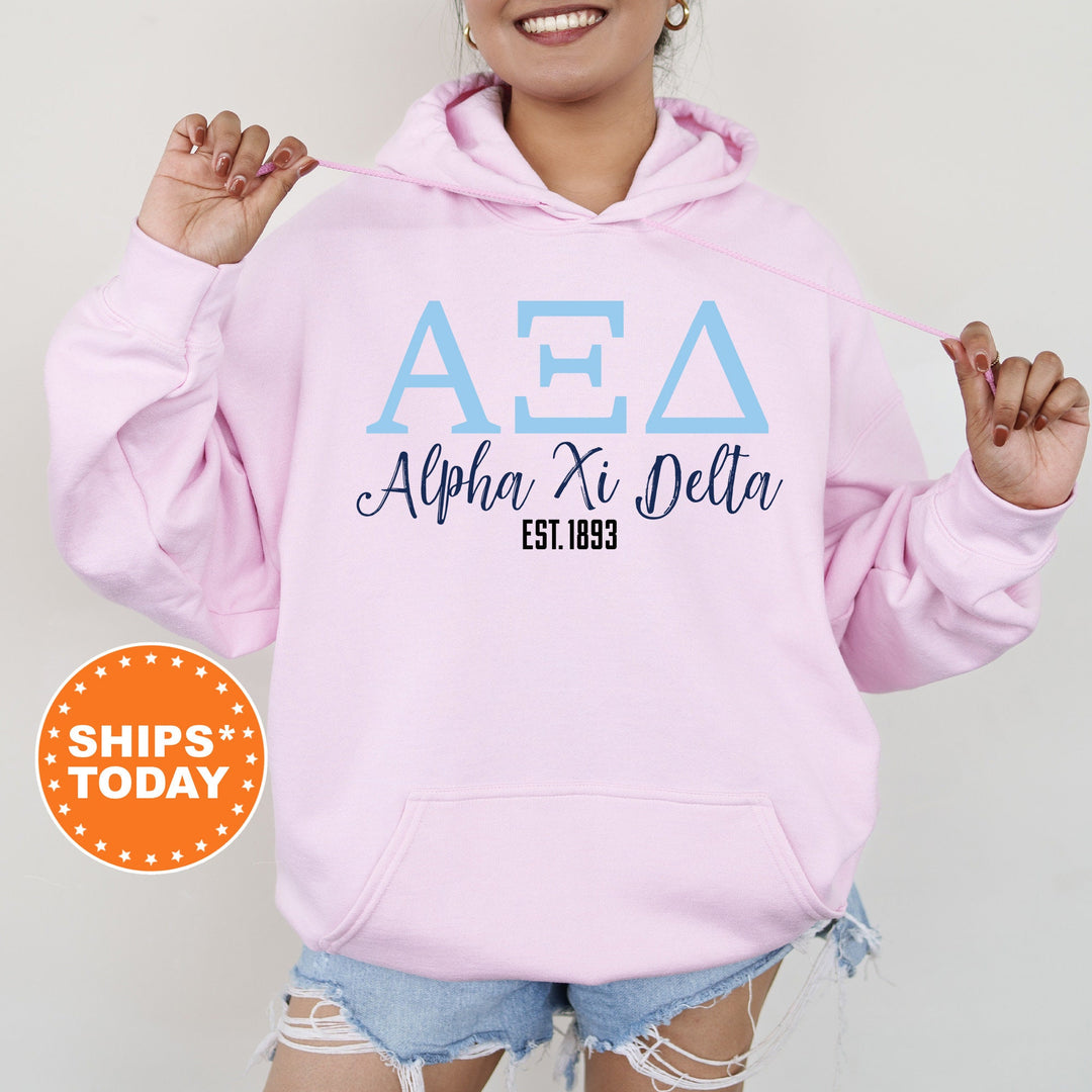 a woman wearing a pink hoodie with the word aea on it