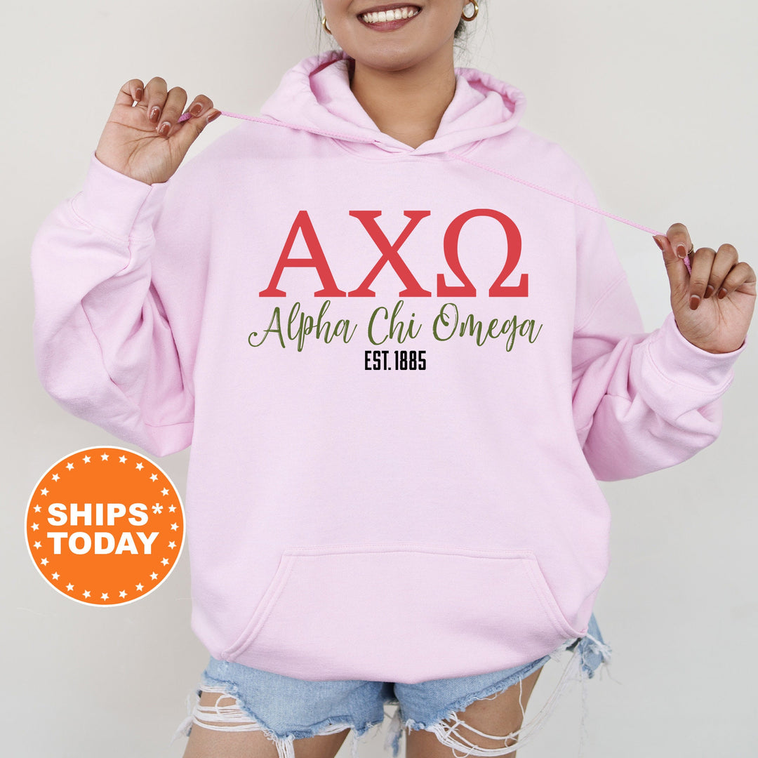 a woman wearing a pink hoodie with the word axq on it