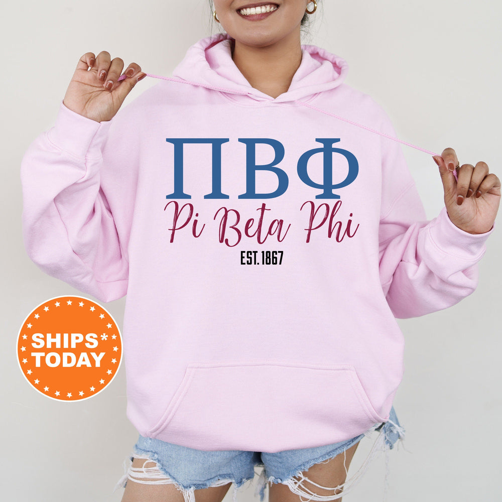 a woman wearing a pink hoodie that says pi beta phi