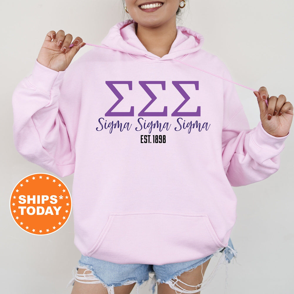 a woman wearing a pink hoodie with the letters sema sema sema