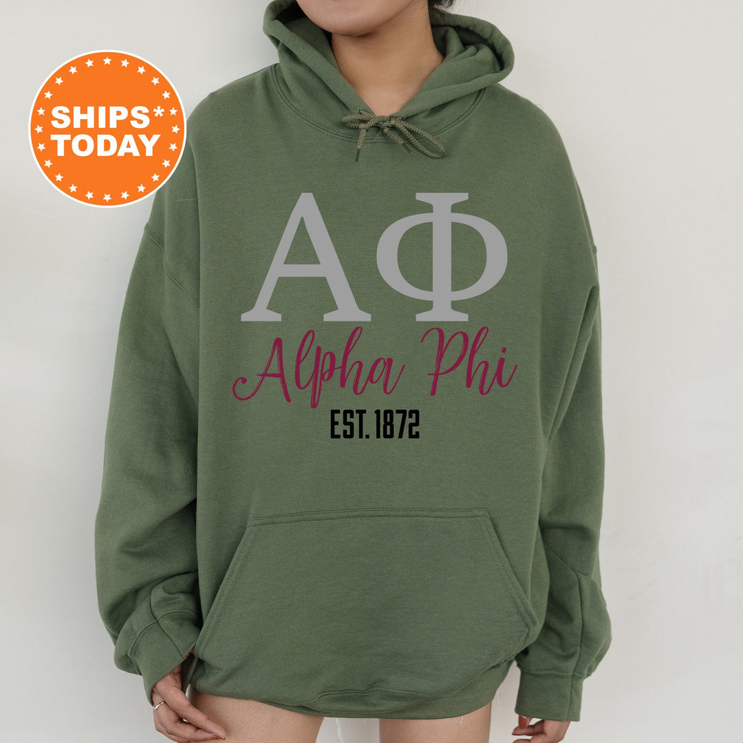 a woman wearing a green phi phi hoodie