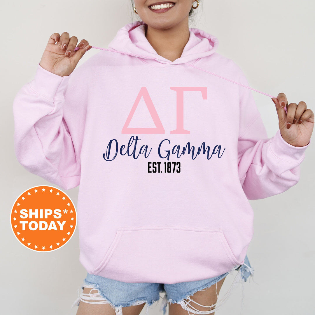 a woman wearing a pink hoodie that says delta garma