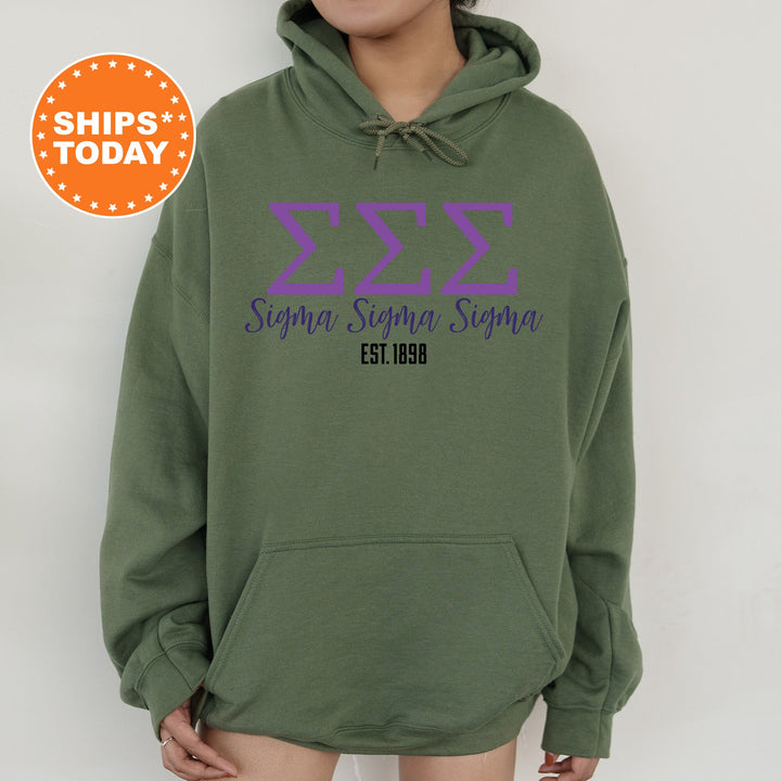 a person wearing a green hoodie with purple letters