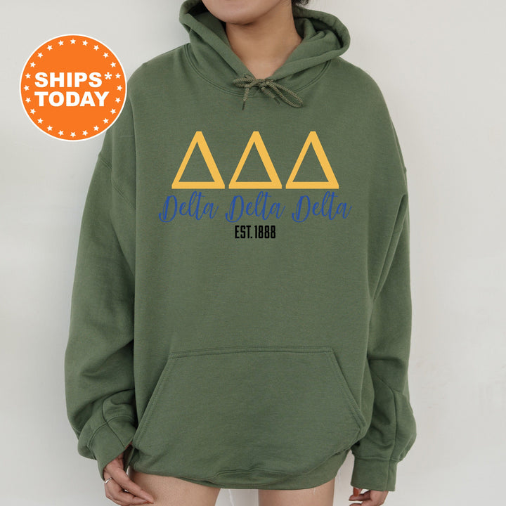 a person wearing a green hoodie with a yellow delta delta on it