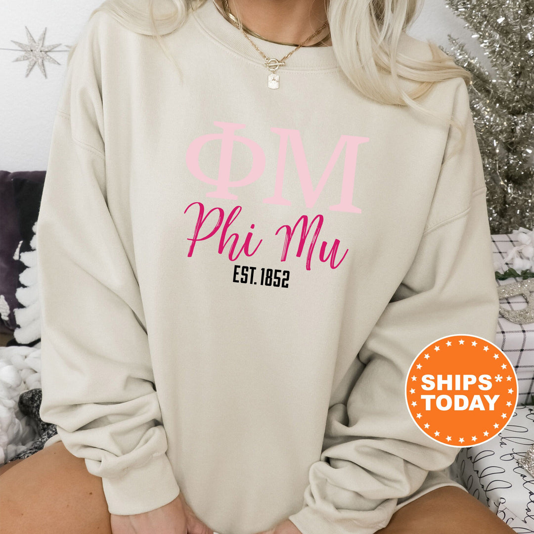 a woman wearing a sweatshirt that says dive phi mu