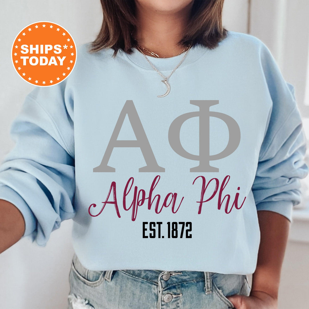 a woman wearing a blue sweatshirt with a phi phi on it