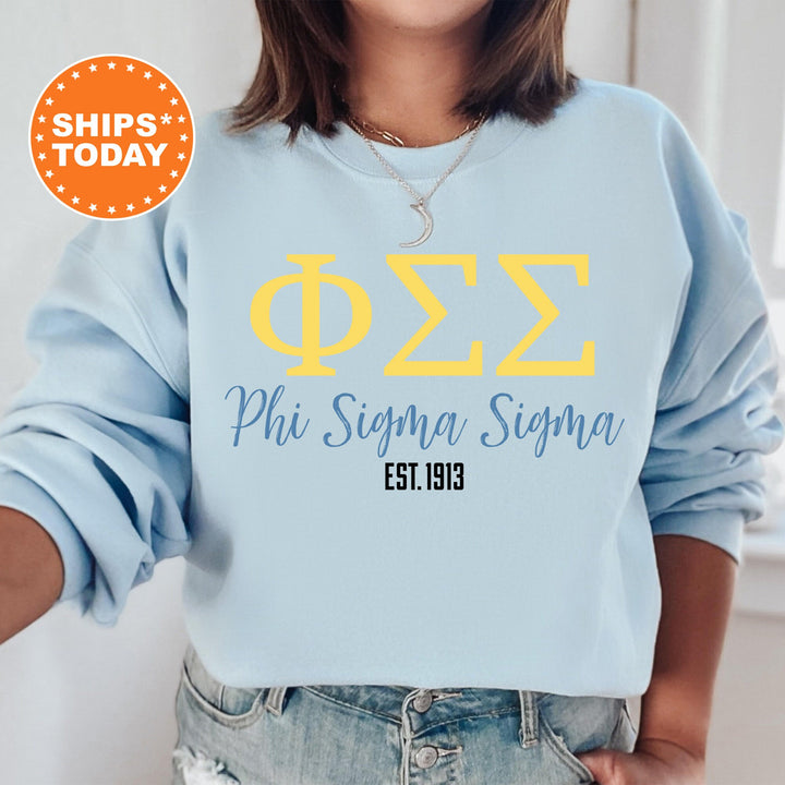 a woman wearing a blue phi phi phi sweatshirt