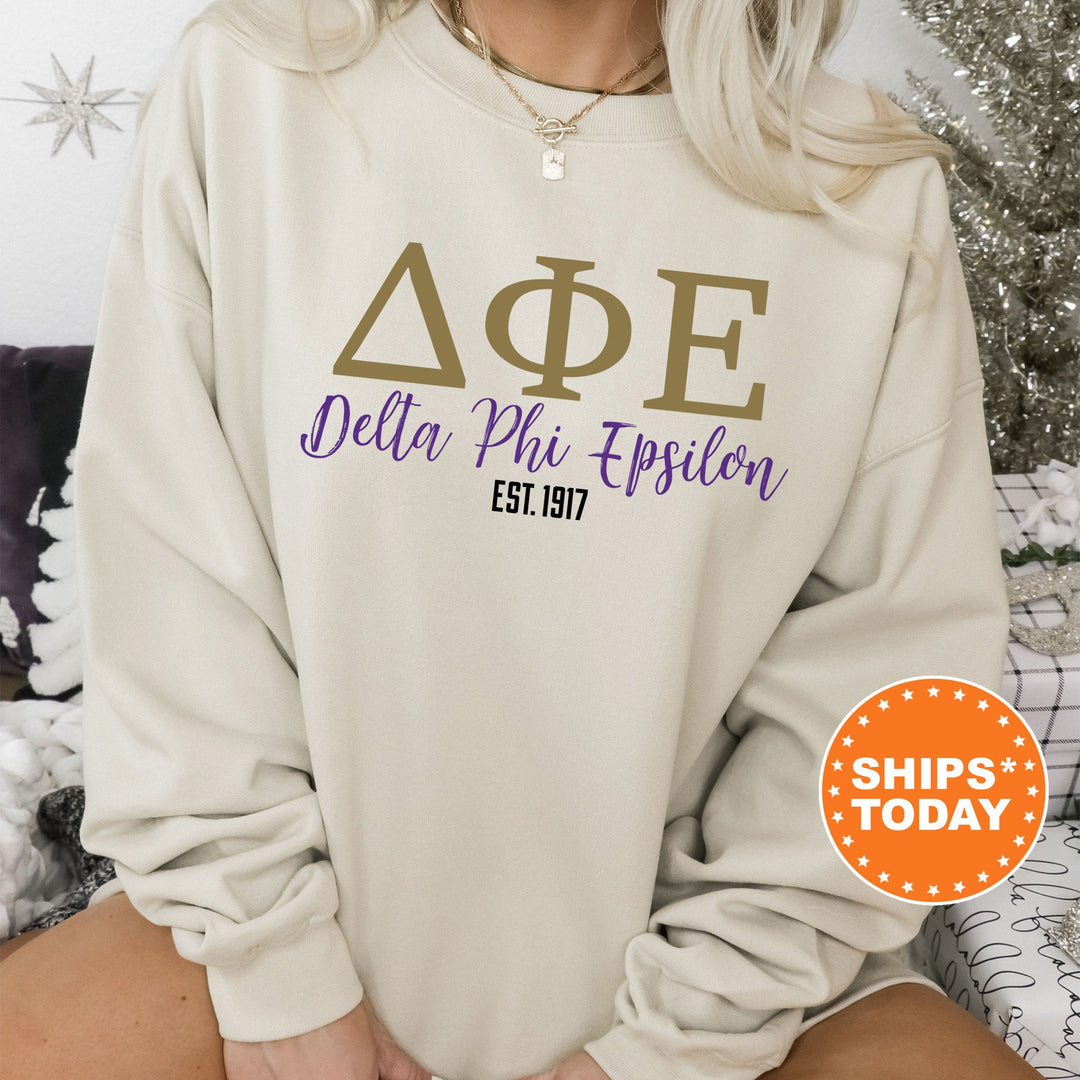 a woman wearing a sweatshirt that says delta phi epiloon