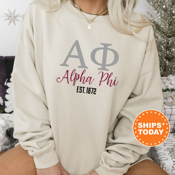 a woman wearing a sweatshirt with the letters a and p on it