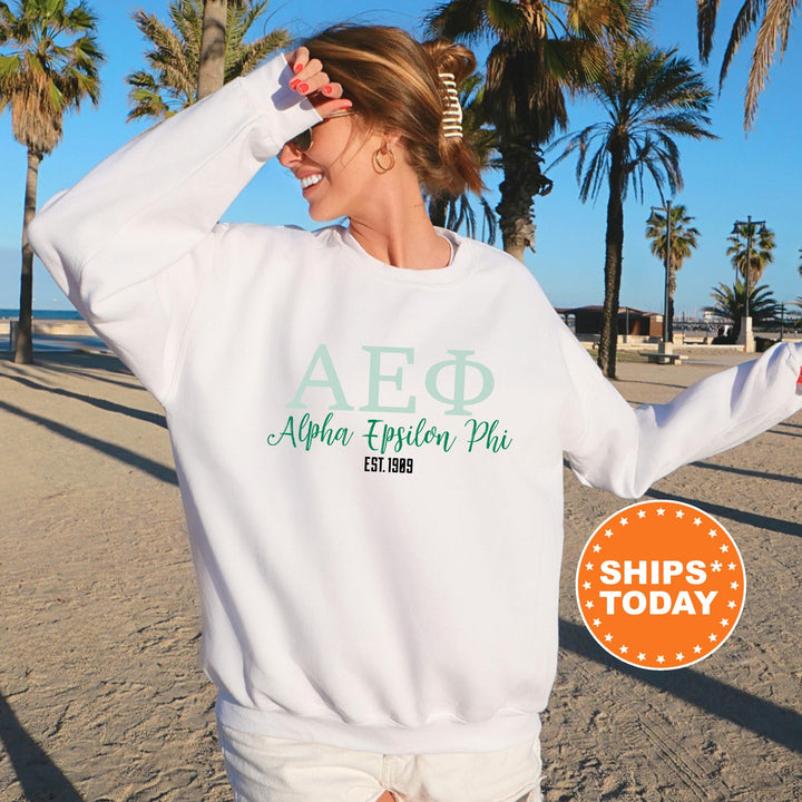 a woman in a white sweatshirt on the beach