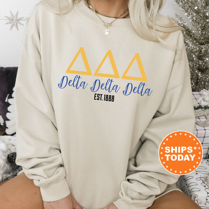 a woman wearing a sweatshirt with delta delta on it