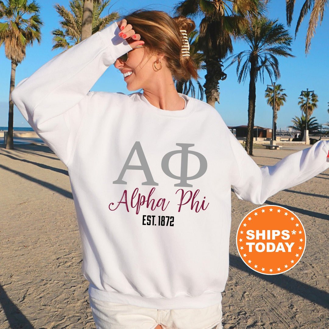 a woman in a white sweatshirt on the beach