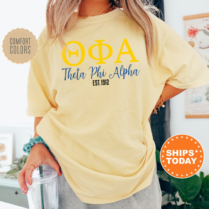 a woman wearing a yellow phi phi phi shirt