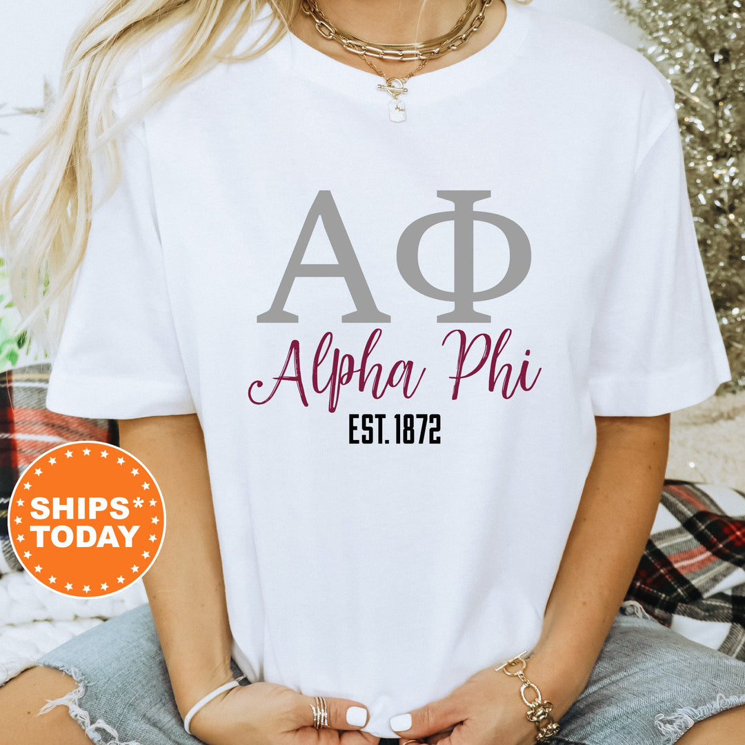 a woman wearing a white shirt with a phi phi on it