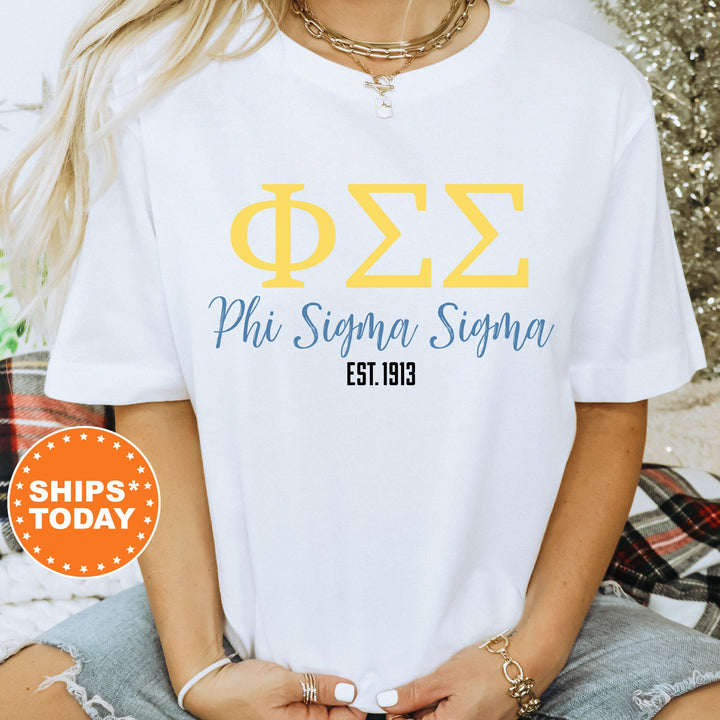 a woman wearing a white phi sigma shirt