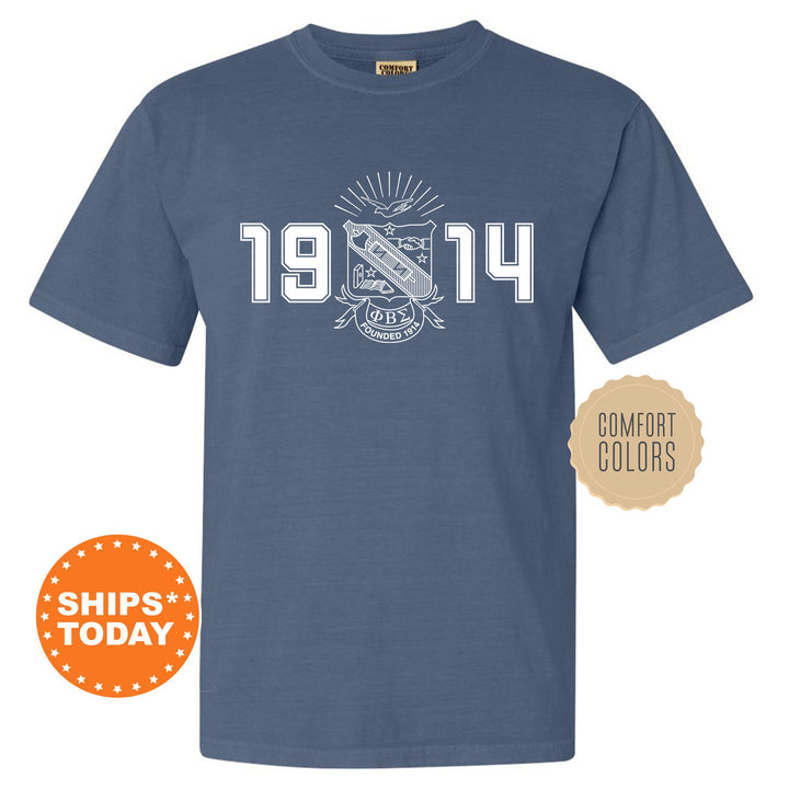 a navy t - shirt with an image of the school&#39;s emblem