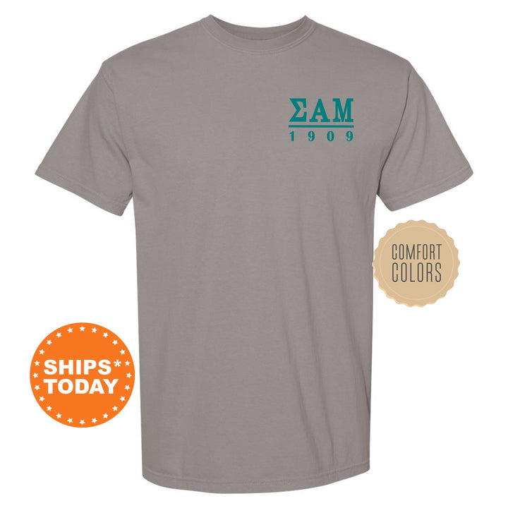 a gray t - shirt with the zam logo on it