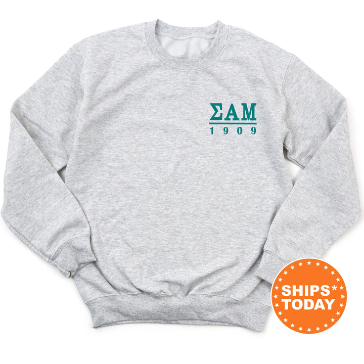 a gray sweatshirt with the zam logo on it