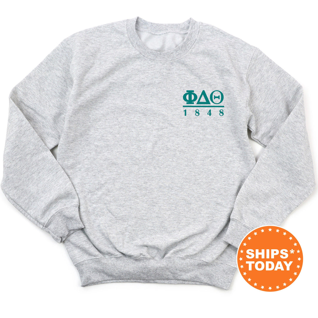 a grey sweatshirt with a green logo on it