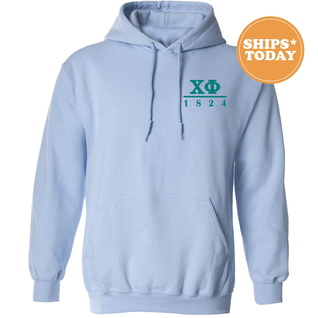 a light blue hoodie with a green xo on it