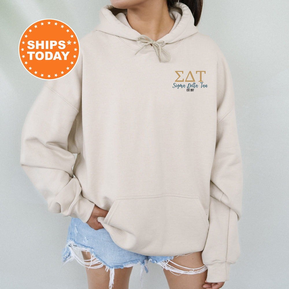a woman wearing a hoodie with the words sat on it