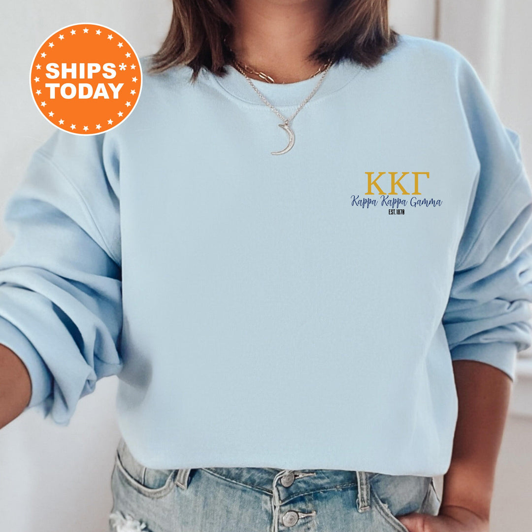 a woman wearing a blue sweatshirt with the words kkt on it