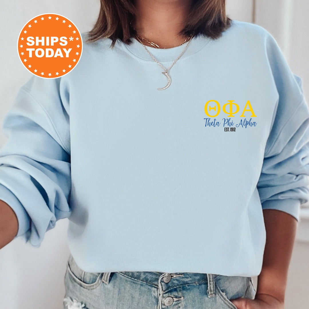a woman wearing a blue sweatshirt with the words goba on it