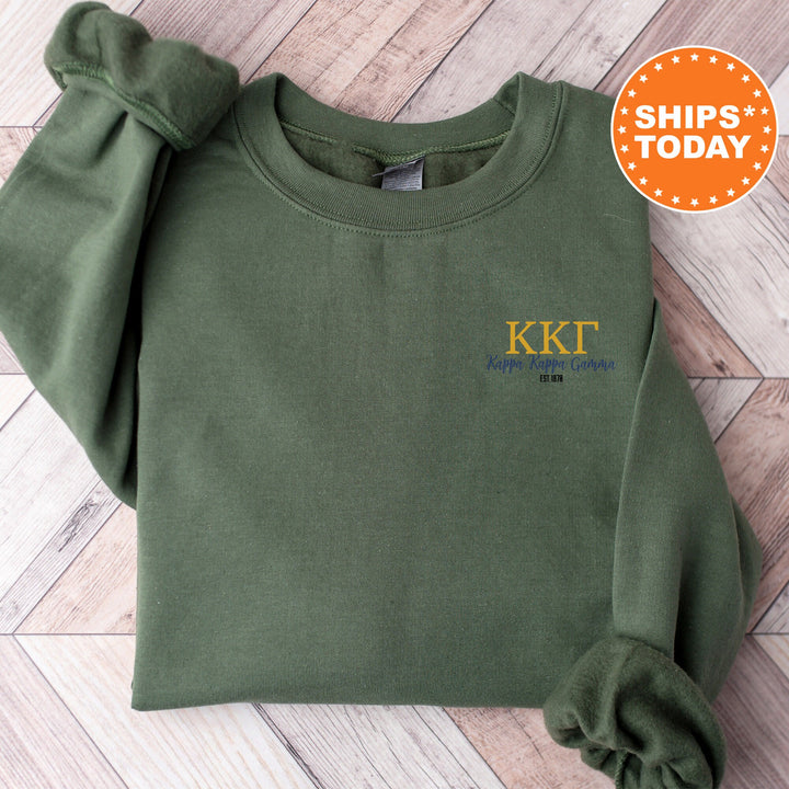 a green sweatshirt with the kkt logo on it