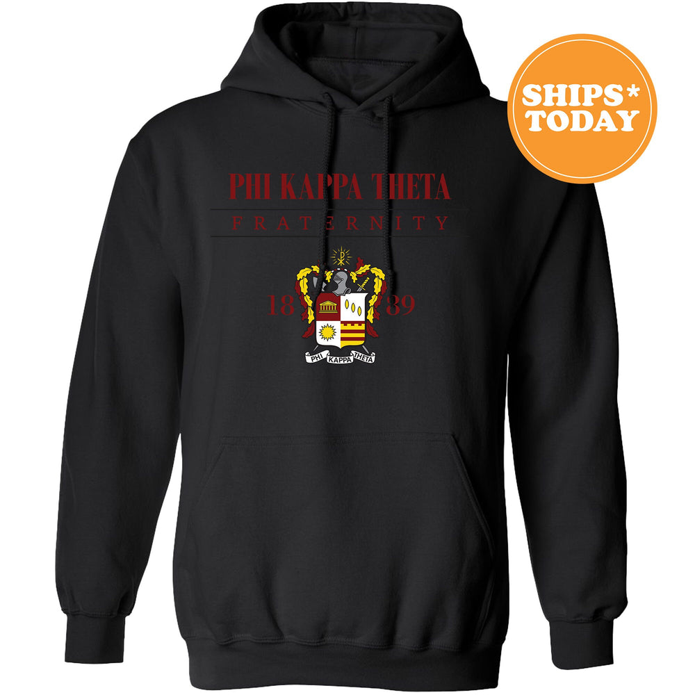 a black hoodie with a red and yellow crest on it