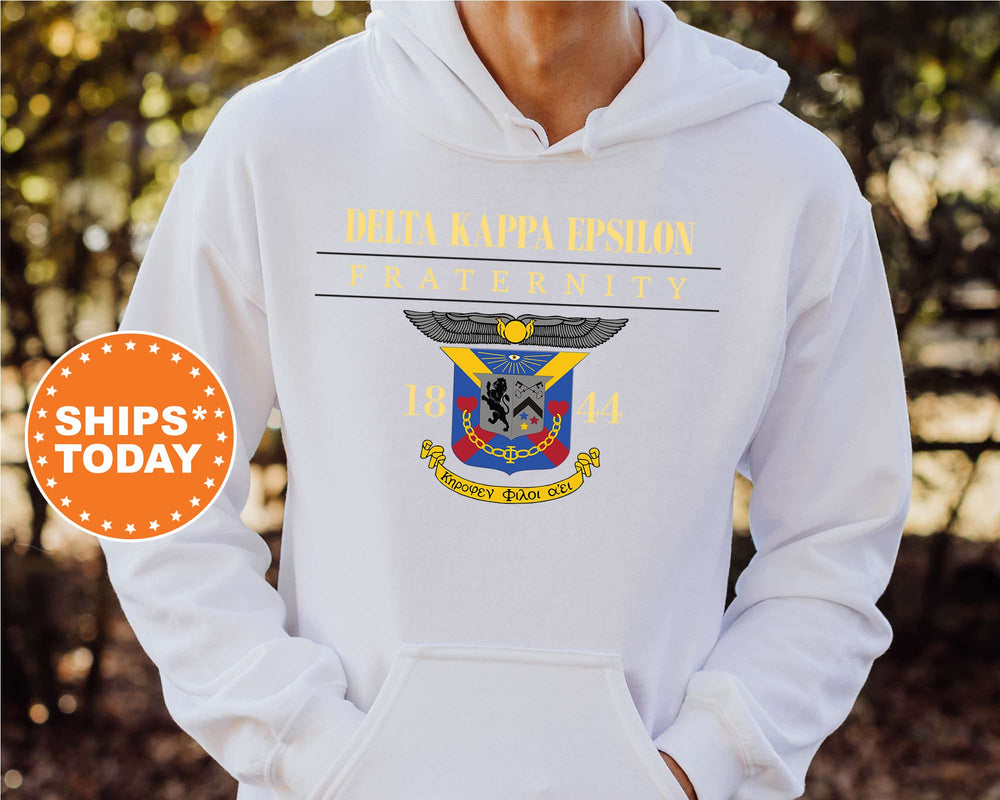 a man wearing a white hoodie with a navy seal on it