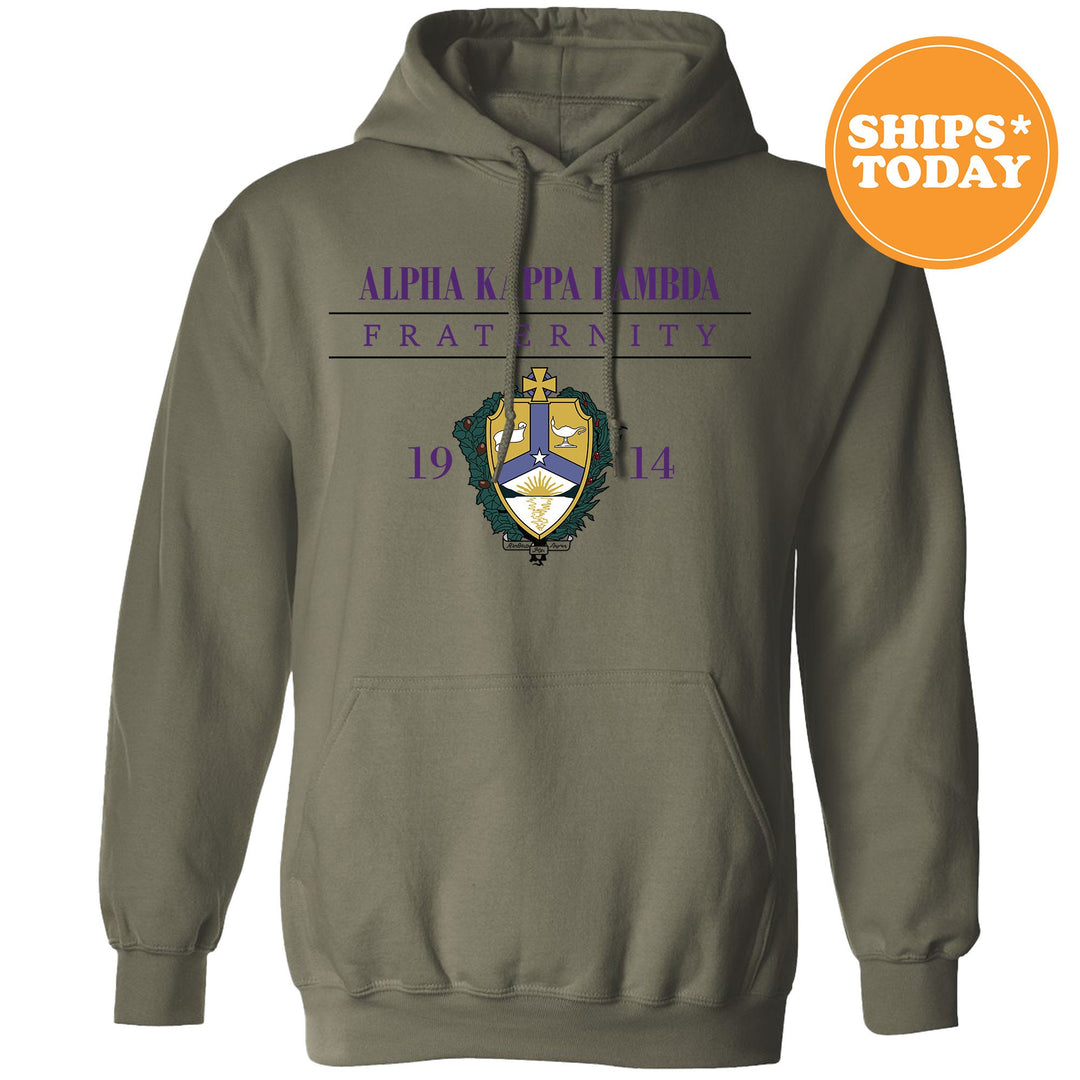 a green hoodie with a purple and yellow crest on it