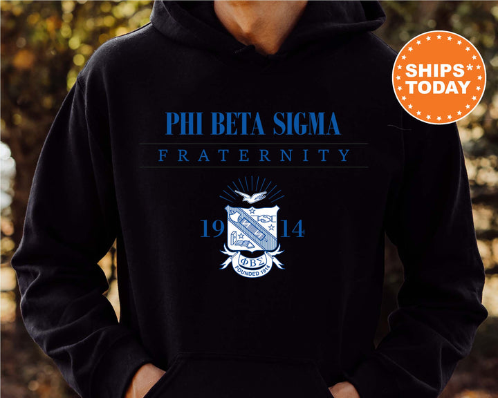 a person wearing a black hoodie with the phibeta sigma fraternity on it
