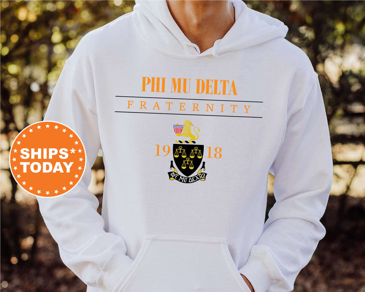 a man wearing a white phi mu delta fraternity hoodie