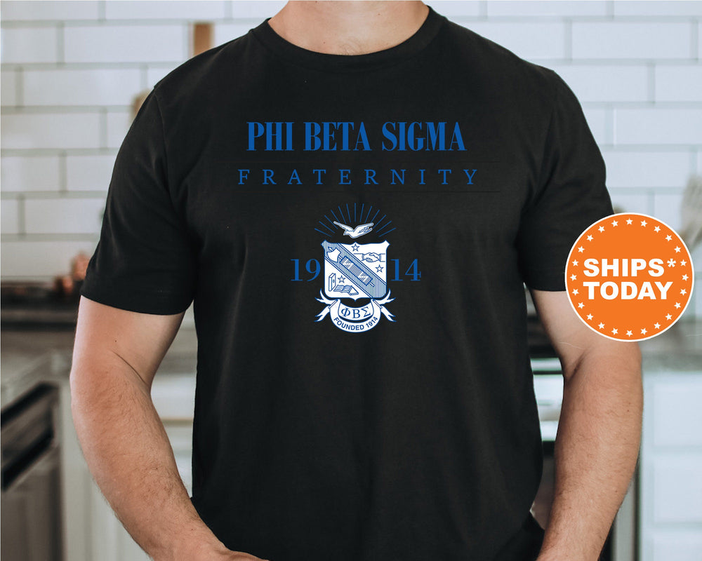 a man wearing a black phi beta signa fraternity t - shirt