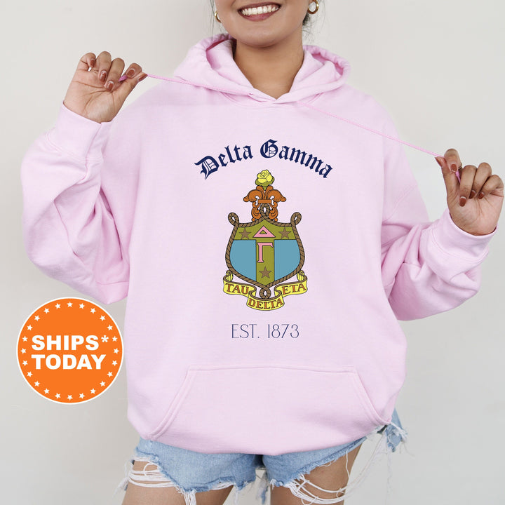 a woman wearing a pink delta gamma hoodie