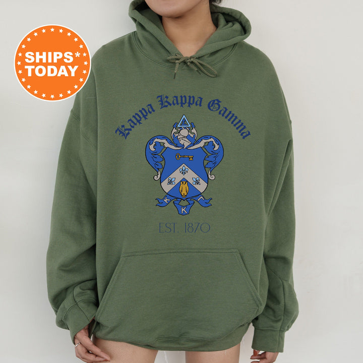 a person wearing a green hoodie with a blue and white crest on it