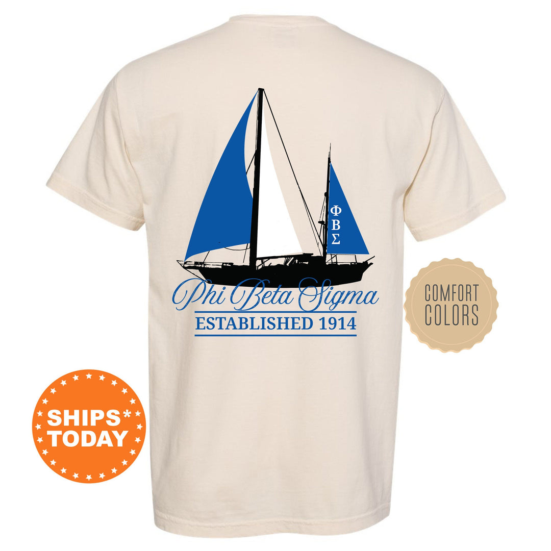 a white shirt with a blue sailboat on it