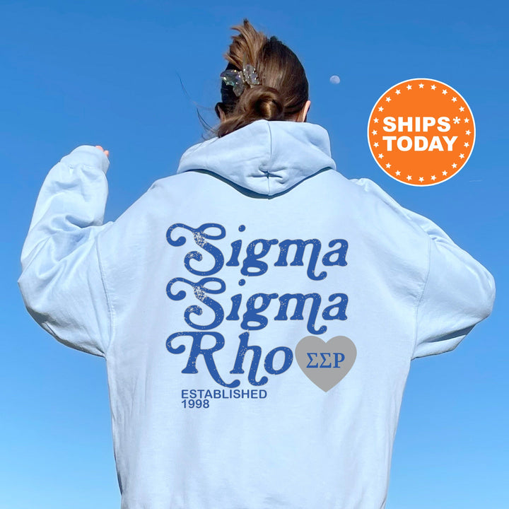 a woman wearing a white sweatshirt with the words stigma stigma rho printed on it