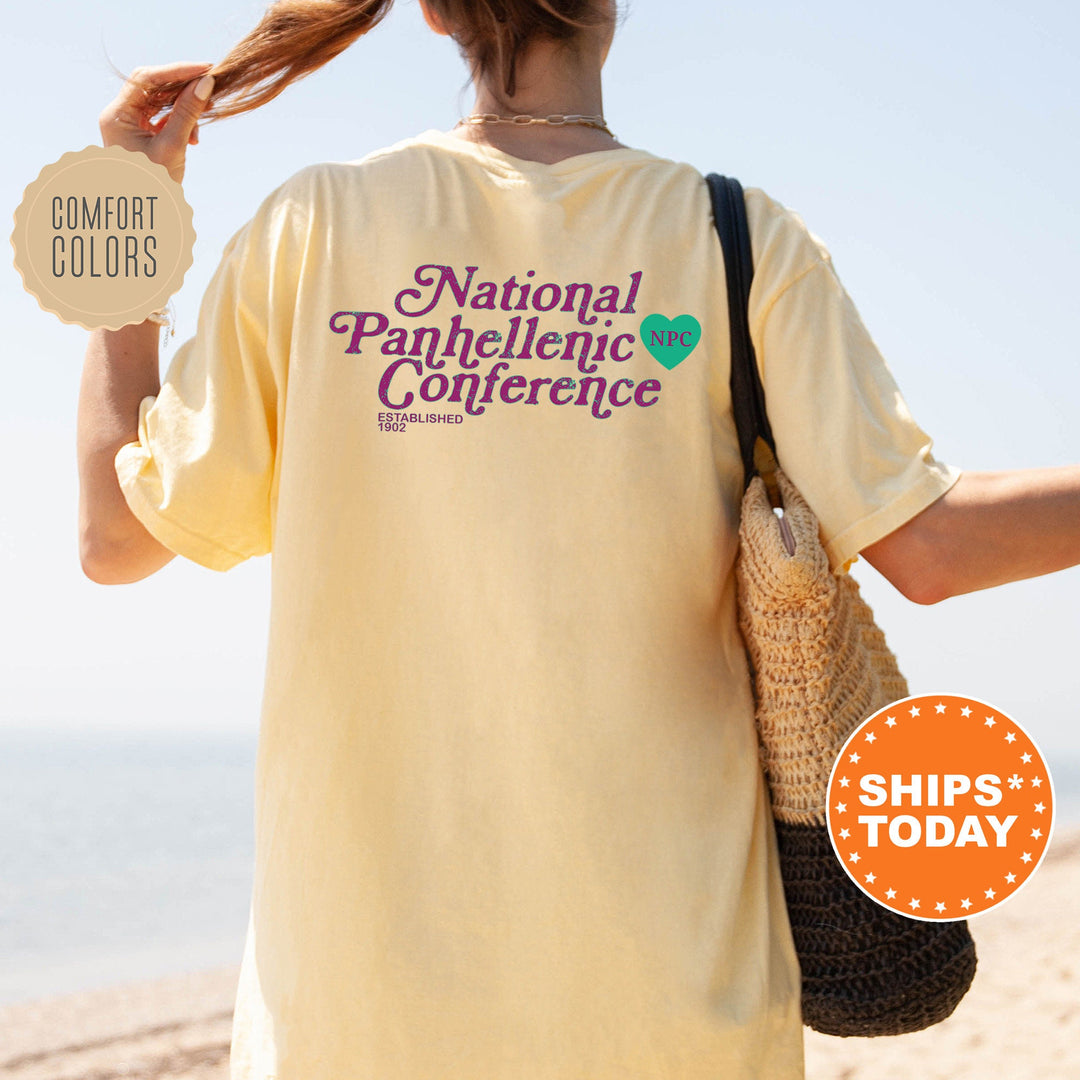 a woman is walking on the beach with her hair in a ponytail